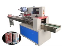 Machine d'emballage automatique de type coussin pour biscuits, chocolats, savons et autres produits alimentaires en sachets plastiques
