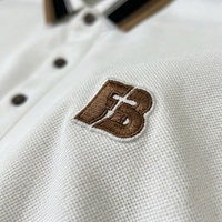 Polo de luxe pour homme à manches longues en coton piqué premium avec col rayé contrastant, broderie tendance, hauts décontractés OEM/ODM