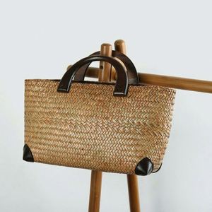 2025 Summer Hot Selling Casual Natural Grass Straw <b>Basket</b> Bag with Wood Handle Literary Retro Travel Beach Handbag - Product Image 1