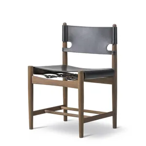 कॉर्डिक ठोस लकड़ी काठी चमड़े के बैक-टू-बैक डाइनिंग चेयर स्पेनिश डिजाइनर क्लासिक घर लकड़ी के आर्मरेस्ट हार्ड चमड़े की कुर्सी.