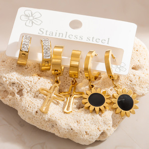 Juego de pendientes colgantes de acero inoxidable con diseño de cruz y girasol, chapados en oro de 18 quilates, de acero titanio para mujer, joyería de moda. - Product Image 1