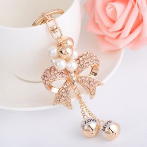 Creative Exquisite New Alloy Bow-shaped Keychain with Pearl String Full Diamonds Girls Car <b>Key</b> <b>Chain</b> for Mother's Day Gift - Product Image 2