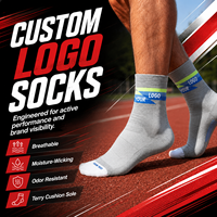 Chaussettes de sport mi-mollet unisexes respirantes grises à séchage rapide avec logo personnalisé