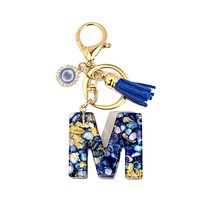 Porte-clés en résine Lettre Œil Turc avec breloque alphabet incrustée de feuille d'or, pompon et accessoires dorés, accessoire de mode pour sac