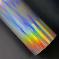 Película de laminación brillante holográfica metálica arcoíris con efecto de relieve suave, impermeable y con brillo, de BOPP, para bolsas de regalo, a bajo precio.