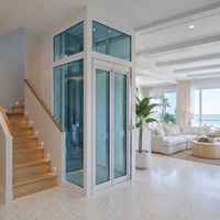 Ascenseur panoramique en verre sur mesure, homologué CE, pour villa de luxe, avec vue verticale.