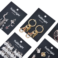 Cartes de présentation de bijoux en papier de luxe de couleur noire avec logo personnalisé de taille mécanique personnalisée avec trou de suspension