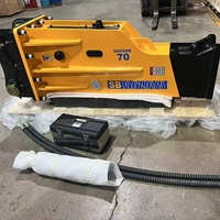 Marteau hydraulique SB70 pour excavatrices (16-21 tonnes) avec burin de 155 mm, accumulateur automatique, garantie 1 an, jaune, 1507 kg, emballage en bois