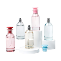Flacons de parfum en verre ronds de 80 ml de qualité supérieure avec des bouchons vaporisateurs à fine brume de luxe pour l'emballage en gros