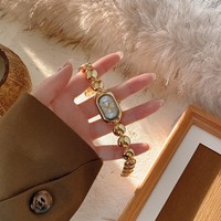 Arloji Baru Terlaris Platinum Brass Mewah Minimalis Oval Fashion Quartz Movement Dial Kecil Eksklusif dengan Tali Jam Tangan