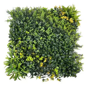 नकली हरी पत्तियां घास 50 * 50 सेमी प्लास्टिक दीवार पर लटकने वाली बॉक्सवुड वर्टिकल पैनल दीवार की सजावट के लिए कृत्रिम पौधे की दीवार