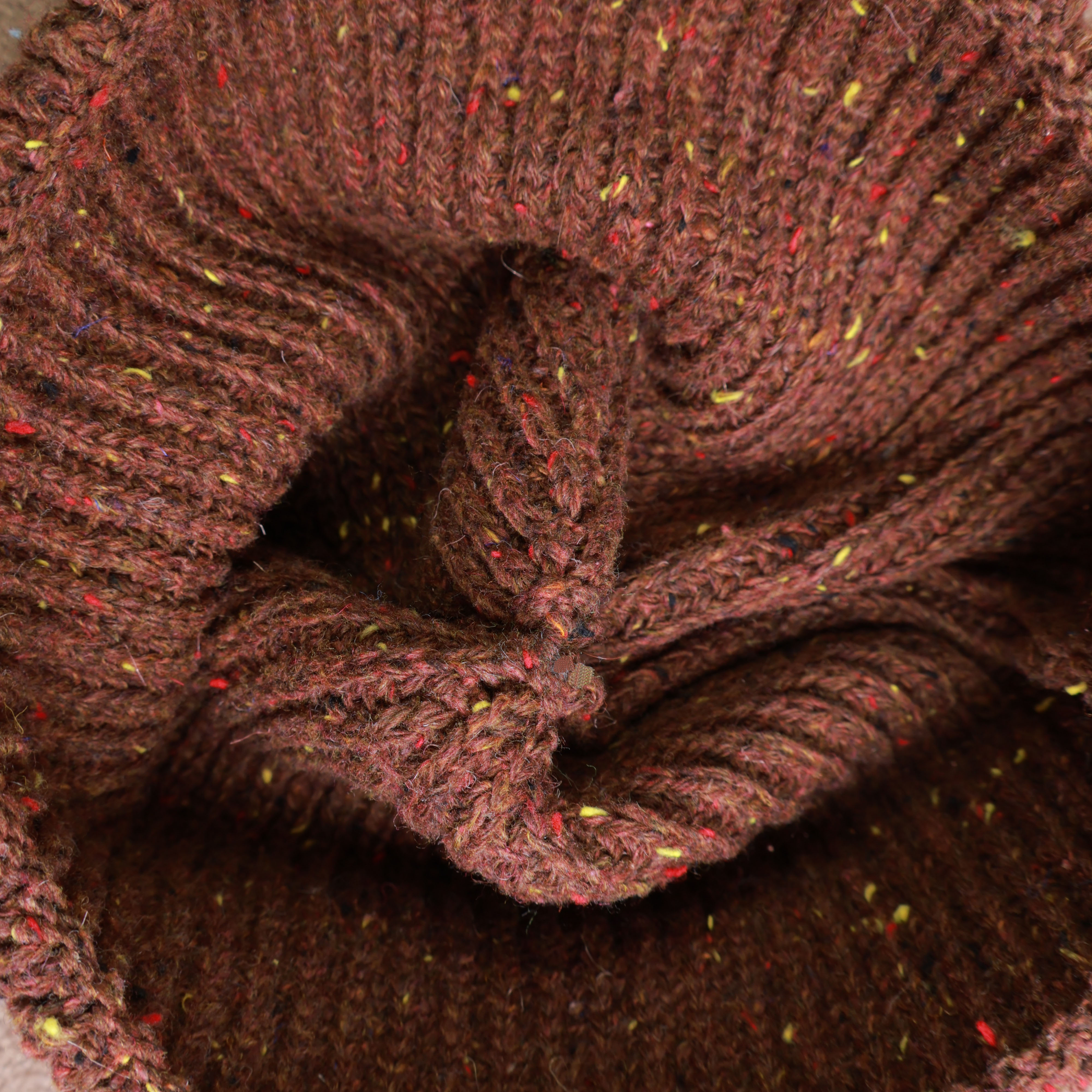 Woven label detail of knitted beanie