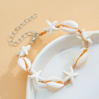 Bracelet en coquillage d'étoile de mer en matériau naturel écologique avec accent turquoise, parfait pour un mariage à la plage ou un festival