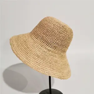 Cappello di paglia all'uncinetto di rafia di moda estiva all'ingrosso della fabbrica cappello da sole a tesa larga da spiaggia cappello di moda da donna con stile semplice