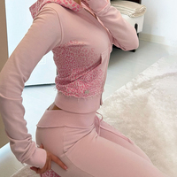 Ensemble de survêtement pour femmes, haut court sexy, vêtements de détente, vêtements d'automne personnalisés OEM, ensemble de survêtement avec capuche à double fermeture éclair et pantalon évasé