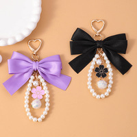 Nouveau porte-clés nœud pour femme, avec ruban en satin, breloque perle, anneau porte-clés, pendentif fleur émaillée pour sac, accessoires de sac à main style coréen