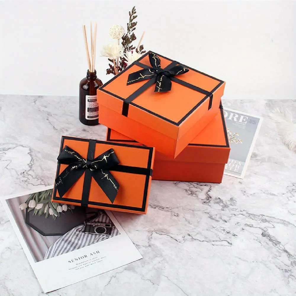 Custom Gift Products Box Package Orange Lid Hard Empty Cardboard Gift Box with Shredded Paper Filler Black Ribbon