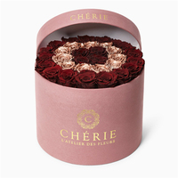 Vente en gros de boîte cadeau d'emballage de fleur rigide noire en papier de carton rond de luxe personnalisé avec ruban
