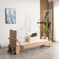 Machine de Pilates Reformer en bois portable et durable de qualité supérieure avec système de tour pour studio et domicile, idéale pour l'exercice du corps entier