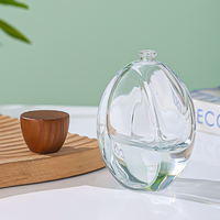 Flacon de parfum ovale transparent personnalisé de luxe 100 ml, flacon d'eau de Cologne à fond épais, bouchon en bois, vaporisateur de parfum