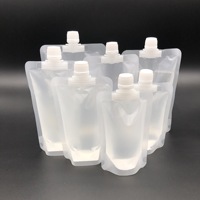 Vente en gros de pochette vide en plastique pour emballage de boisson liquide avec bec verseur 50 100ML PE pochette transparente avec bec verseur