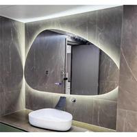 Miroir de salle de bain LED lumineux de luxe en promotion avec design goutte d'eau irrégulier pour la maison et l'hôtel