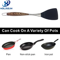 Spatule à fentes en silicone résistante à la chaleur de style moderne avec manche en acier inoxydable durable et revêtement en bois pour la cuisine domestique