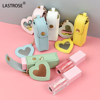 Vente en gros d'étui pour rouge à lèvres en cuir PU avec miroir étui à breloques portable pour femmes porte-clés rouge à lèvres
