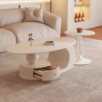 Ensemble de tables basses modernes haut de gamme, durables, avec rangement, compactes, légèrement luxueuses, de style français, en dalle de pierre ovale, couleur crème, pour salon