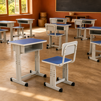 Ensemble bureau et chaise d'école compact et réglable avec plateau en panneau de particules et structure métallique pour salle de classe et bureau à domicile