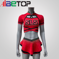 Service OEM personnalisé : Ensemble d'uniformes de cheerleading en strass, comprenant un crop top à manches courtes et dos croisé, une jupe et un short, en Polyester Spandex, avec logo d'équipe