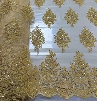 Tissu en dentelle tissée de haute qualité, lourdement orné de perles et de sequins, brodé pour robes de mariée et usage en confection de jouets.