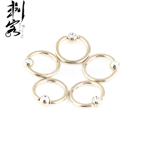 จิวใส่จมูกปิดรูเจาะจมูกแบบใสขนาด14นิ้วทำจากสเตนเลสสตีลเคลือบทอง - Product Image 1