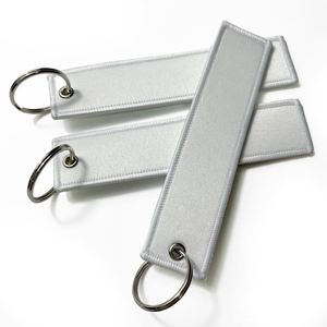 Wholesale Customized High End <b>Key</b> Label <b>Custom</b> Jet Tag Woven Brand Embroidered Keychain - Product Image 1