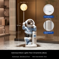 Résine créative faite à la main Art déco couloir d'astronaute écologique grands ornements au sol meuble TV vocal intelligent