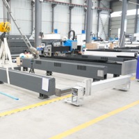 Mesin Pemotong Laser Fiber CNC Gantry Dengan Daya 6000W dan Meja Ganti untuk Pemrosesan Plat Logam Baja Aluminium Format Besar