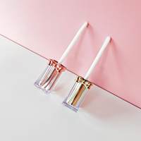 Nouveau tube de brillant à lèvres de luxe carré clair personnalisé avec baguette avec nœuds en or rose sur le couvercle Lip Glaze Empty Tube lip gloss base