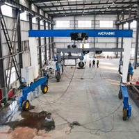 Grue à portique mobile sur roues en caoutchouc personnalisée de 5 à 100 tonnes pour le levage de poutres en béton
