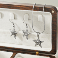 Vente en gros de boucles d'oreilles et de colliers en acier inoxydable anti-rouille, imperméables, délicats, en forme d'étoile, pour femmes
