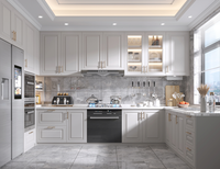 Meuble de cuisine modulaire classique personnalisable en bois peint jaune clair avec évier, marbre et quincaillerie à fermeture douce pour appartement