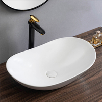Lavabo en céramique noir mat de style moderne, lavabo de comptoir ovale, lavabo de salle de bain noir