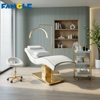 Nouveau style : Ensemble lit de soin et chariot à base dorée, lit SPA vert haut de gamme pour centre de bien-être féminin, table de massage électrique réglable