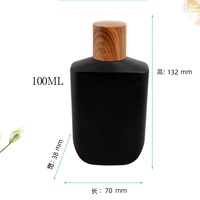 Flacon de parfum rectangulaire arrondi noir mat de 100 ml avec bouchon en bois, vide et rechargeable, vente en gros directe d'usine