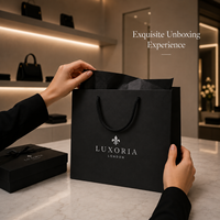 Maßgefertigte Luxus-Papiertüten in Mattschwarz mit Silberprägung und Logo für Boutique-Geschenke, Schmuck und Modeverpackungen