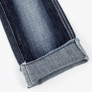 En gros 78% Coton 20% Polyester 2% Spandex jeans tissu sergé croisé extensible 4 voies slub denim selvedge tissu fabricant