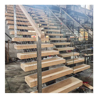 Escalier moderne en bois massif durable à monopoutre droite avec marches en bois et garde-corps à câbles pour usage extérieur