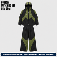 Ensemble assorti pour homme noir personnalisé, veste coupe-vent en nylon à motif géométrique et blocs de couleur, pantalon large coupe-vent pour le streetwear