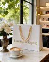 Sac de shopping en papier blanc de luxe, personnalisé, fait main, écologique, recyclable, avec logo en feuille d'or gaufrée et ruban, pour boutique de cosmétiques