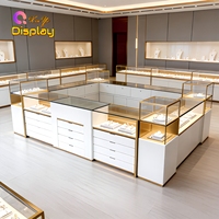 Vitrine de Luxe pour Bijoux avec Éclairage LED en Verre et Acier Inoxydable Doré, Écologique, Idéale pour Centres Commerciaux et Magasins de Détail