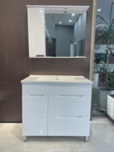 Simple white <b>freestanding</b> <b>bathroom</b> vanity with integrated sink and soft closing storage drawers - Product Image 1
